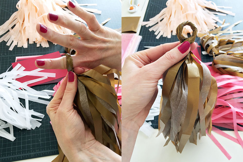 Making tassels for the custom handmade tissue tassel garland for client bridal shower
